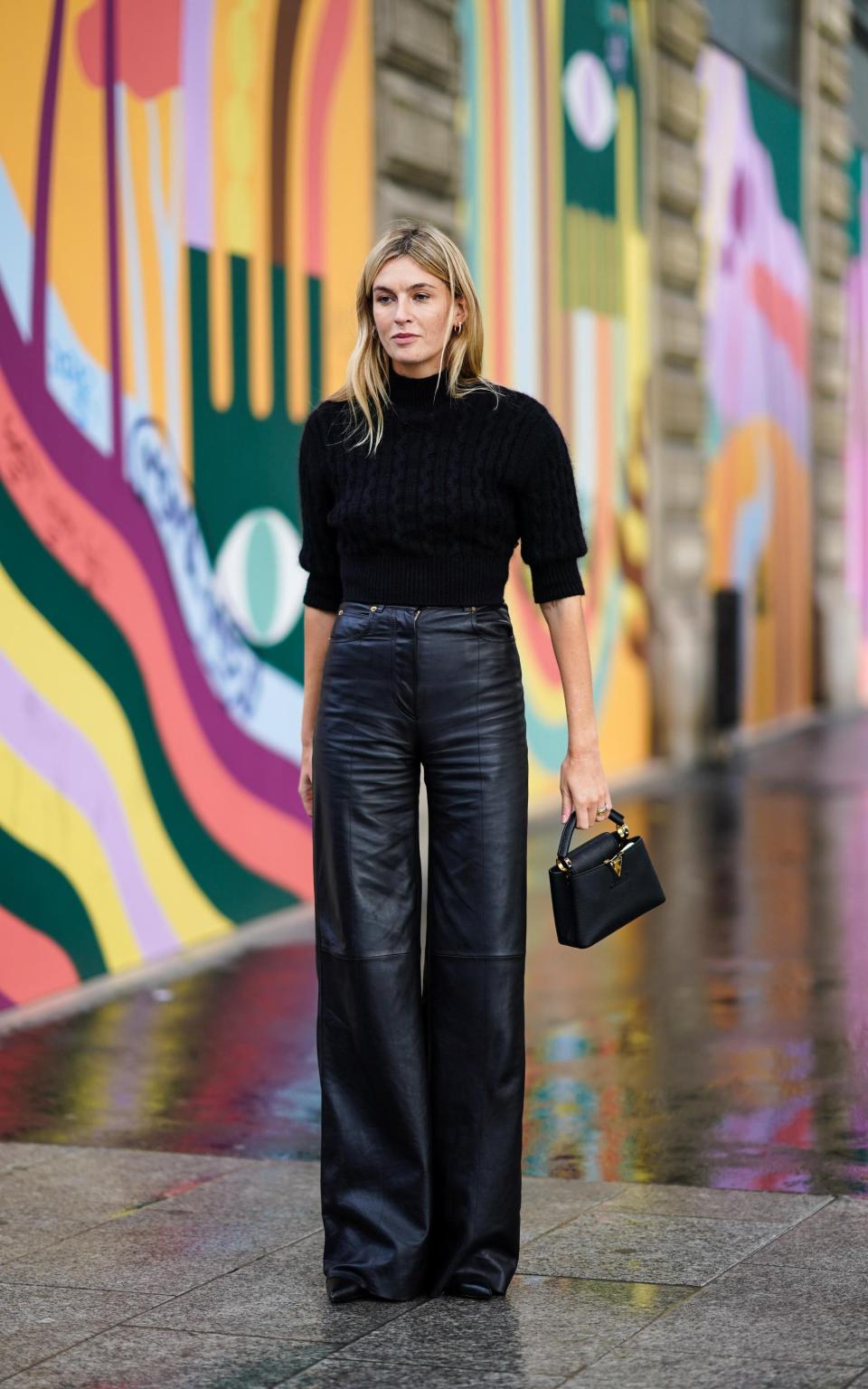 Camille Charriere in black leather trousers - Getty Images