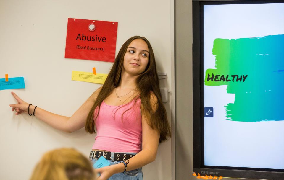 Taylor Collins, 17, a senior, takes part in weeklong teen violence-prevention and healthy relationships program called Power. Holly Smith, a community prevention coordinator with Abuse and Rape Crisis Shelter in Warren County leads the class. On day two, students had to decide if scenarios given to them were healthy, unhealthy, abusive or somewhere in the middle.