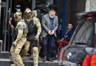 Special police units from EULEX arrest Hysni Gucati, leader of Kosovo Liberation Army War Veterans Organisation in Pristina