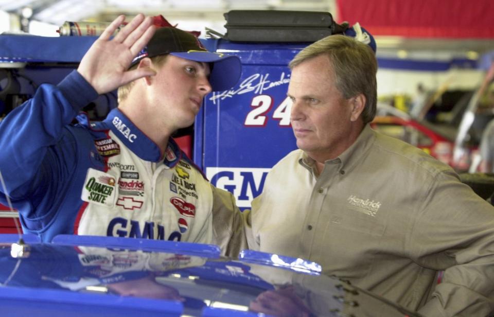 FILE - Driver Ricky Hendrick, left, talks with his father, Rick Hendrick, during testing at Lowe's Motor Speedway in Concord, N.C., May 7, 2001. (Christopher A. Record/The Charlotte Observer via AP, File)