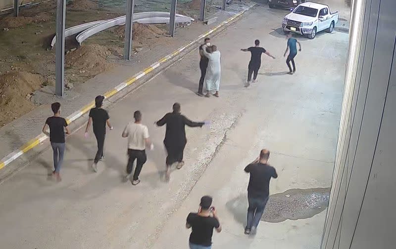 Relatives of a patient, who died from the coronavirus disease (COVID-19), beat up Tarik Sheibani, 47, an Iraqi doctor and director of Al-Amal Hospital, in this still image taken from CCTV footage obtained by Reuters, in Najaf