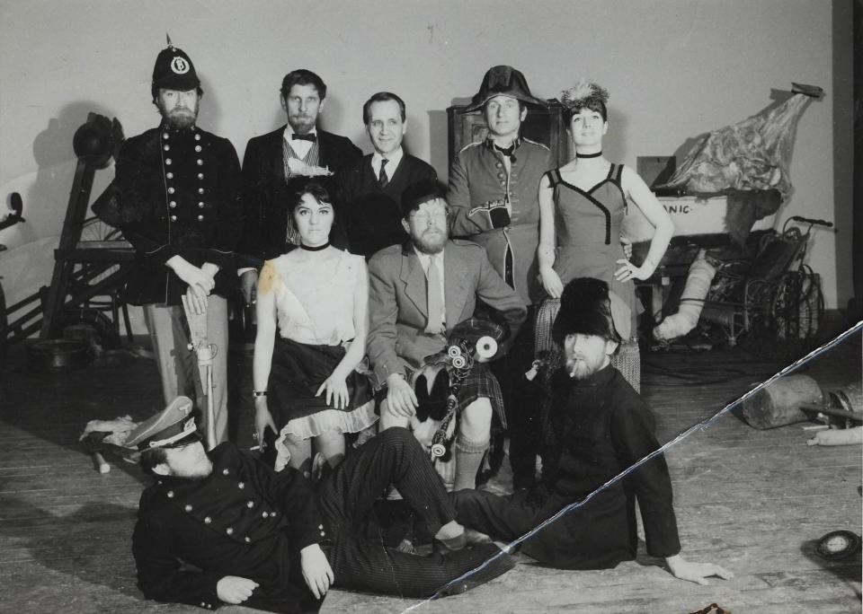 Douglas Gray (seated, with bagpipes) and fellow cast members of An Evening of British Rubbish