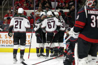 The Arizona Coyotes celebrate a goal by Christian Fischer during the first period of an NHL hockey game against the Carolina Hurricanes in Raleigh, N.C., Sunday, Oct. 31, 2021. (AP Photo/Karl B DeBlaker)