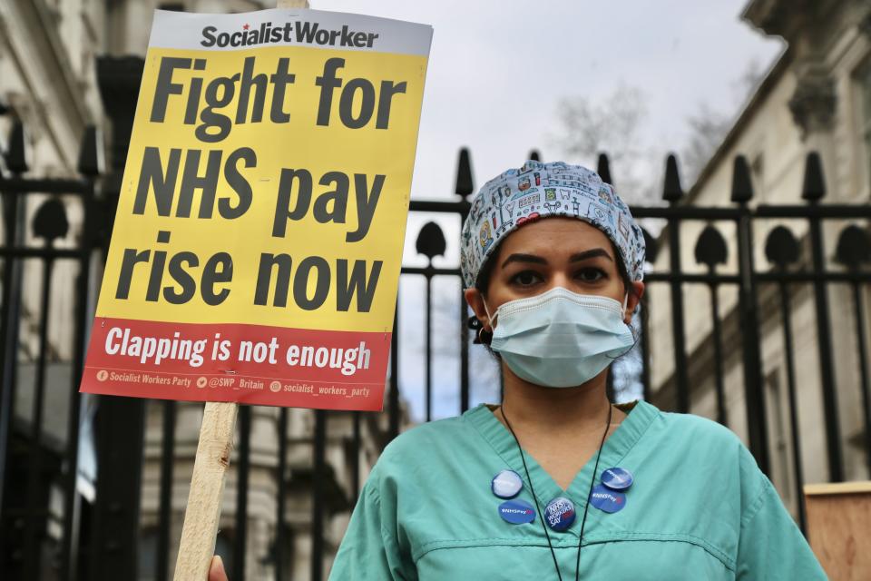 LONDON, UNITED KINGDOM - MARCH 7: NHS nurses gather outside 10 Downing street to protest the government's decision to recommend a 1% pay rise in London, United Kingdom on March 7, 2021. (Photo by Hasan Esen/Anadolu Agency via Getty Images)