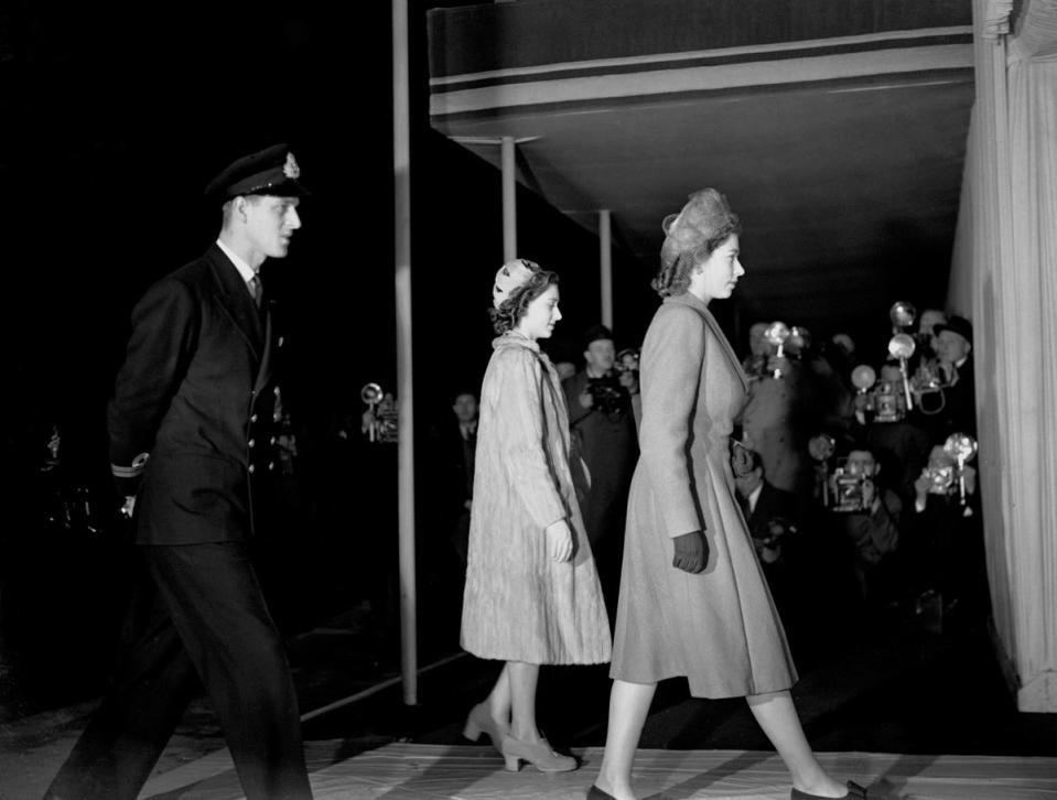 Princess Elizabeth, Princess Margaret and Lieutenant Philip Mountbatten entering the Westminster Abbey for a wedding rehearsal (PA )
