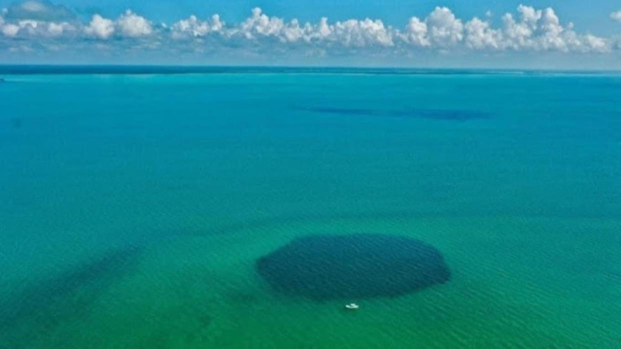  An aerial view of the Taam Ja' Blue Hole. 