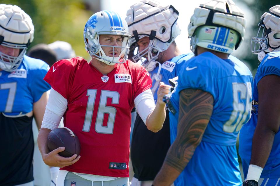 Detroit Lions quarterback Jared Goff (16) greets offensive tackle Darrin Paulo (66) during a joint practice with the Indianapolis Colts at NFL football training camp in Westfield, Ind., Thursday, Aug. 18, 2022.