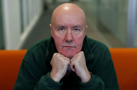 Scottish author Irvine Welsh poses for a photograph during an interview with Reuters ahead of the premiere of the film "T2 Trainspotting" in Edinburgh January 22, 2017. REUTERS/Russell Cheyne