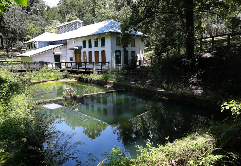 The boarded up windows on the pump house building at Boulware Springs Park and Historic Waterworks sits over the artesian spring that helped lift Gainesville from sleepy town to rural metropolis, in Gainesville, Fla. Aug. 11, 2021.