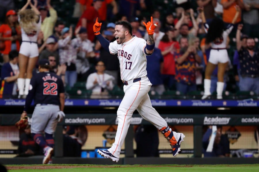 Houston Astros’ Victor Caratini (17) rounds the bases as he celebrates his walk-off home run against the Cleveland Guardians during the 10th inning of a baseball game Tuesday, April 30, 2024, in Houston. (AP Photo/Michael Wyke)