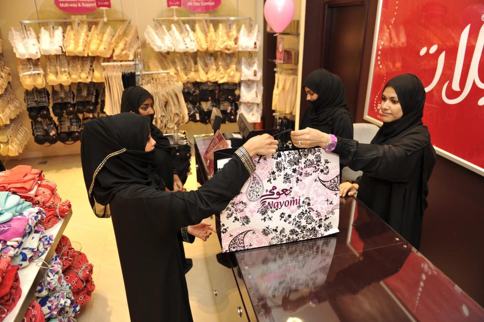 A law on the books since 2006 is finally implemented, allowing women to work as sales' clerks in female apparel and lingerie stores. Saudi Arabia's most senior cleric, Sheik Abdul-Aziz Al Sheikh, spoke out against the Labor Ministry's decision in a sermon just before the law was applied, saying it contradicts Islamic law. The kingdom's religious establishment follows a strict interpretation of Islam known as Wahhabism.  <em>Fully-veiled Saudi women shop at a lingerie store in the Saudi Red Sea port of Jeddah on January 2, 2012. From this week, only female staff will be able to sell women's lingerie in Saudi Arabia (AMER HILABI/AFP/Getty Images)</em>