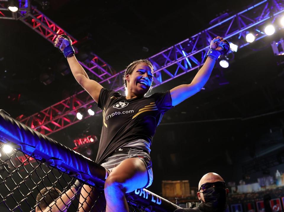 Julianna Pena celebrates after becoming new women’s bantamweight champion (Getty Images)