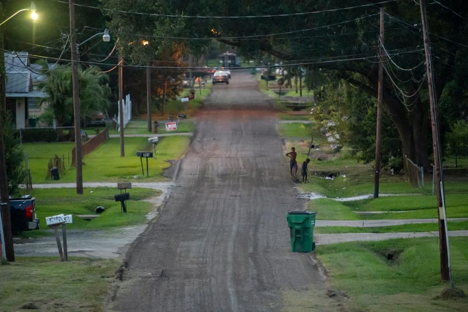 Children play in the residential streets of Reserve, Louisiana, just down the road from the Denka Performance Elastomer plant.