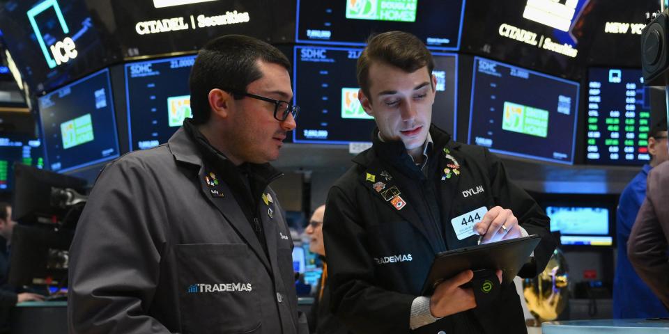 Traders work on the floor of the New York Stock Exchange (NYSE) during morning trading on January 11, 2024 in New York City.