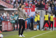 Leverkusen's head coach Xabi Alonso gestures during the Bundesliga soccer match between 1. FC Cologne and Bayer 04 Leverkusen in Cologne, Germany, Sunday, March 3, 2024. (Rolf Vennenbernd/dpa via AP)