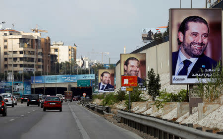 Posters depicting Saad al-Hariri, who announced his resignation as Lebanon's prime minister from Saudi Arabia, is seen at airport high way in Beirut, Lebanon November 19, 2017. REUTERS/Jamal Saidi