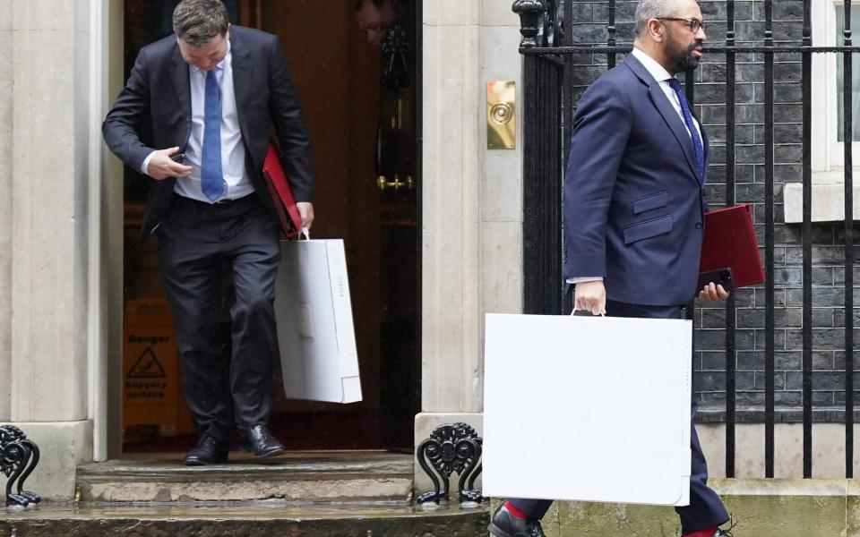 Mel Stride, the Work and Pensions Secretary, and James Cleverly, the Home Secretary, are pictured leaving 10 Downing Street this morning after a meeting of the Cabinet