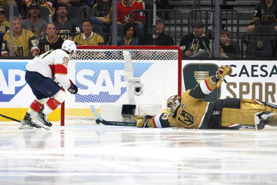 Vegas Golden Knights goalie Adin Hill makes a stick save against the Florida Panthers' Nick Cousins.