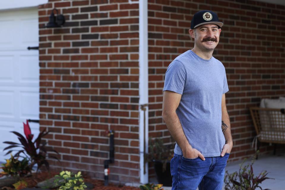 Christopher Goodyear is shown in portrait Monday at his home in Orange Park. The 32-year-old firefighter, paramedic and Navy veteran recently secured his home through the Veterans Affairs (VA) loan program.