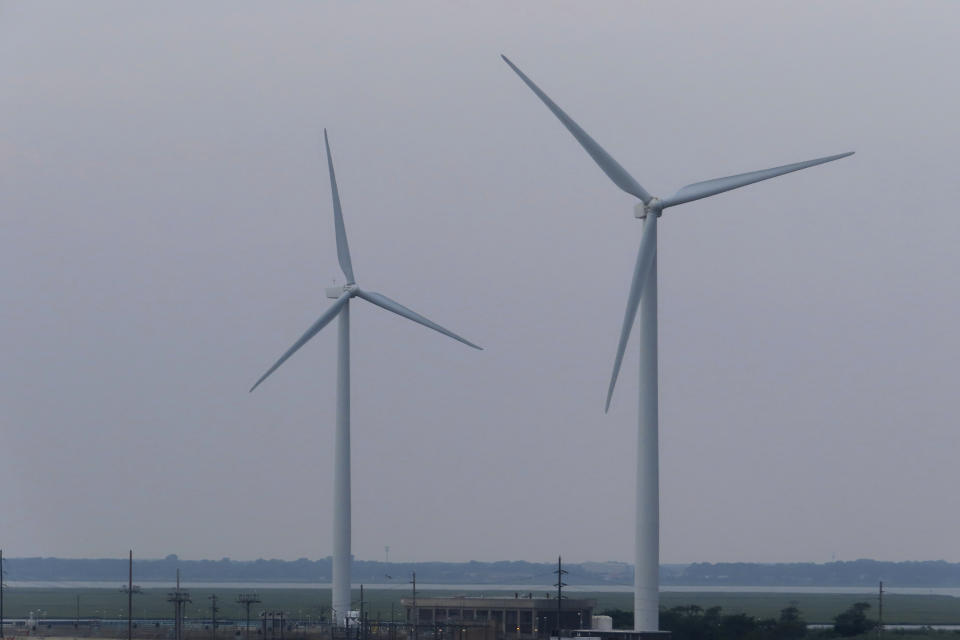 FILE - Land-based wind turbines turn in Atlantic City, N.J. on July 20, 2023. On Monday, July 1, 2024, the U.S,. Interior Department approved the Atlantic Shores offshore wind project in New Jersey, which would be the state’s first wind farm once additional federal and state approvals are granted. (AP Photo/Wayne Parry, File)