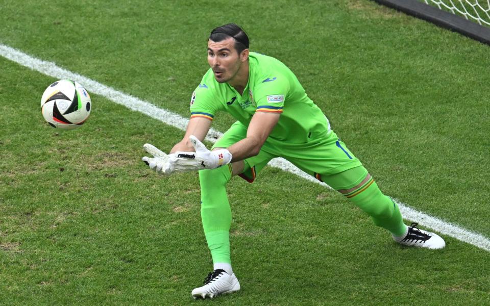 Romania goalkeeper Florin Nita makes a comfortable save.