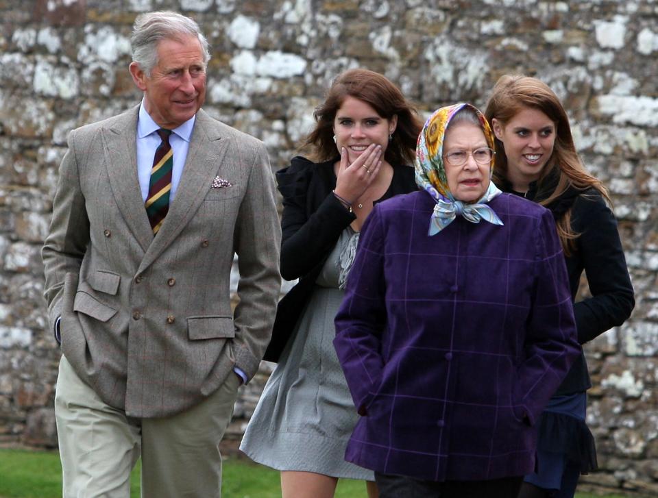 SCRABSTER, UNITED KINGDOM - AUGUST 02: Queen Elizabeth II (R) accompanied by Prince Charles, Prince of Wales (L), Princess Eugenie, (C), and Princess Beatrice and the rest of the Royal family arrive at the Castle of Mey after disembarking the Hebridean Princess boat after a private family holiday around the Western Isles of Scotland, on August 02, 2010 in Scrabster, Scotland. (Photo by Andrew Milligan - WPA Pool/Getty Images)