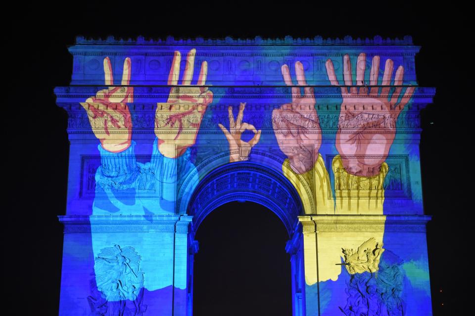 Images are projected on the Arc de Triomphe monument during a laser and 3D video mapping show as part of New Year's celebrations in Paris on December 31, 2017. (Photo: GUILLAUME SOUVANT via Getty Images)