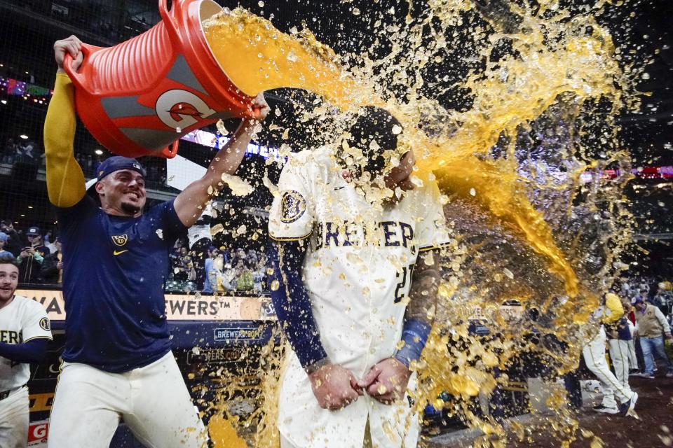 Milwaukee Brewers' Willy Adames douses Joey Ortiz after a walk off hit during the 11th inning of a baseball game against the New York Yankees Friday, April 26, 2024, in Milwaukee. The Brewers won 7-6. (AP Photo/Morry Gash)