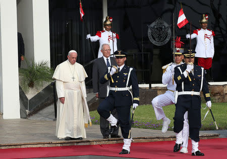 Pope Francis is greeted by Peru's President Pedro Pablo Kuczynski as he arrives in Lima, Peru, January 18, 2018. REUTERS/Alessandro Bianchi