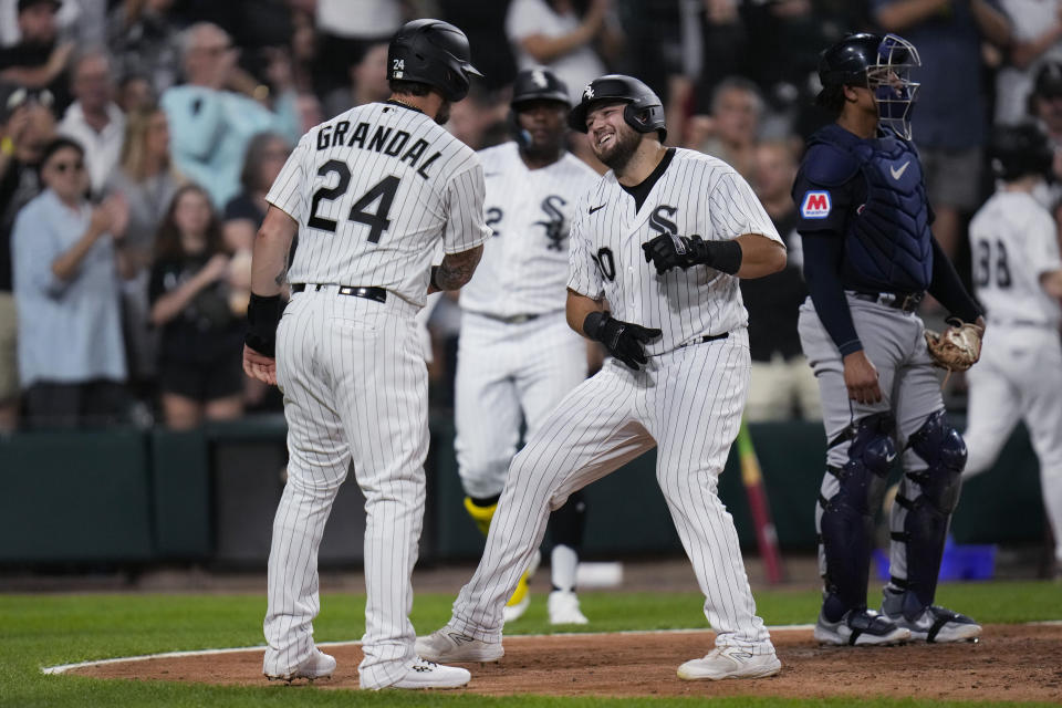 Chicago White Sox's Jake Burger, right, and Yasmani Grandal celebrate after Burger hit a two-run home run against the Cleveland Guardians during the fifth inning of a baseball game Thursday, July 27, 2023, in Chicago. (AP Photo/Erin Hooley)