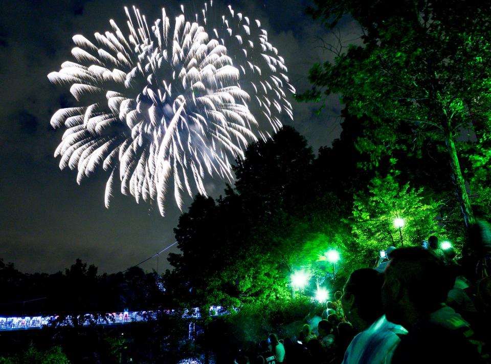 People watch fireworks during the Red, White & Blue Festival in downtown Greenville Thursday, July 4, 2019.