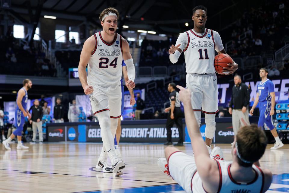 Drew Timme of Gonzaga celebrates with Corey Kispert and Joel Ayayi against Creighton during the second half of their Sweet Sixteen game of the 2021 NCAA men's tournament at Hinkle Fieldhouse.