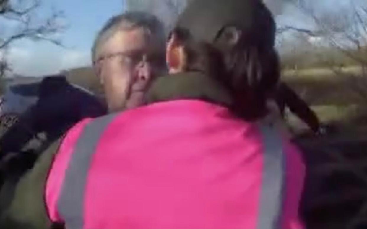 A hunt steward is confronted by a man who shouts abuse during the demonstration in Warwickshire