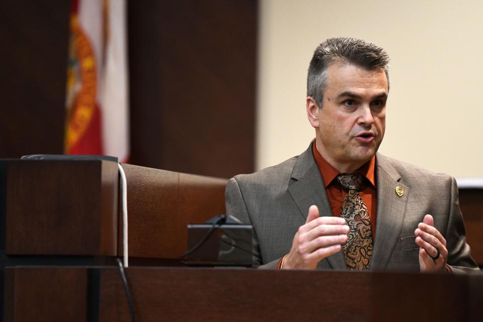 Tallahassee Police Department Sergeant Christopher Corbitt, a digital forensics investigator, directs his attention to the jury as he shares what information he found while looking into cell phone records. 