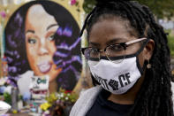 Millicent Cahoon stands for a portrait, Thursday, Sept. 24, 2020, in Louisville, Ky. “It’s reiterating to me that my life does not matter, that I’m unsafe,” said Millicent Cahoon, a therapist who started a counseling network for the protest movement. (AP Photo/John Minchillo)