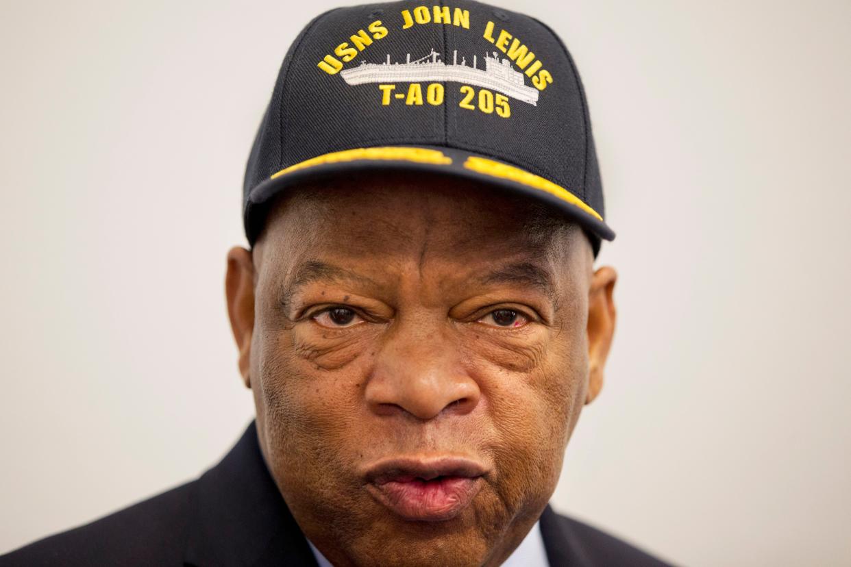 Rep. John Lewis, D-Ga. wears a hat with the ship fleet that is being named after him during a ceremony with Navy Secretary Ray Mabus, Jan. 6, 2016 in Washington. (AP Photo/Jacquelyn Martin)