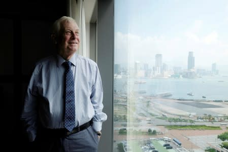 FILE PHOTO: Former Hong Kong governor Chris Patten poses during an interview in Hong Kong