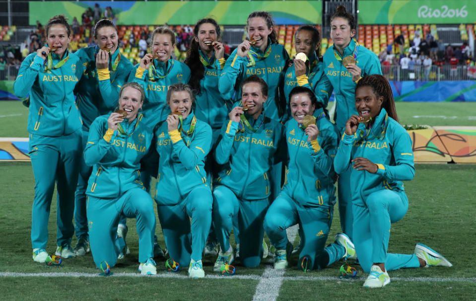 Team of Australia celebrates after winning the women's Rugby Sevens gold medal match