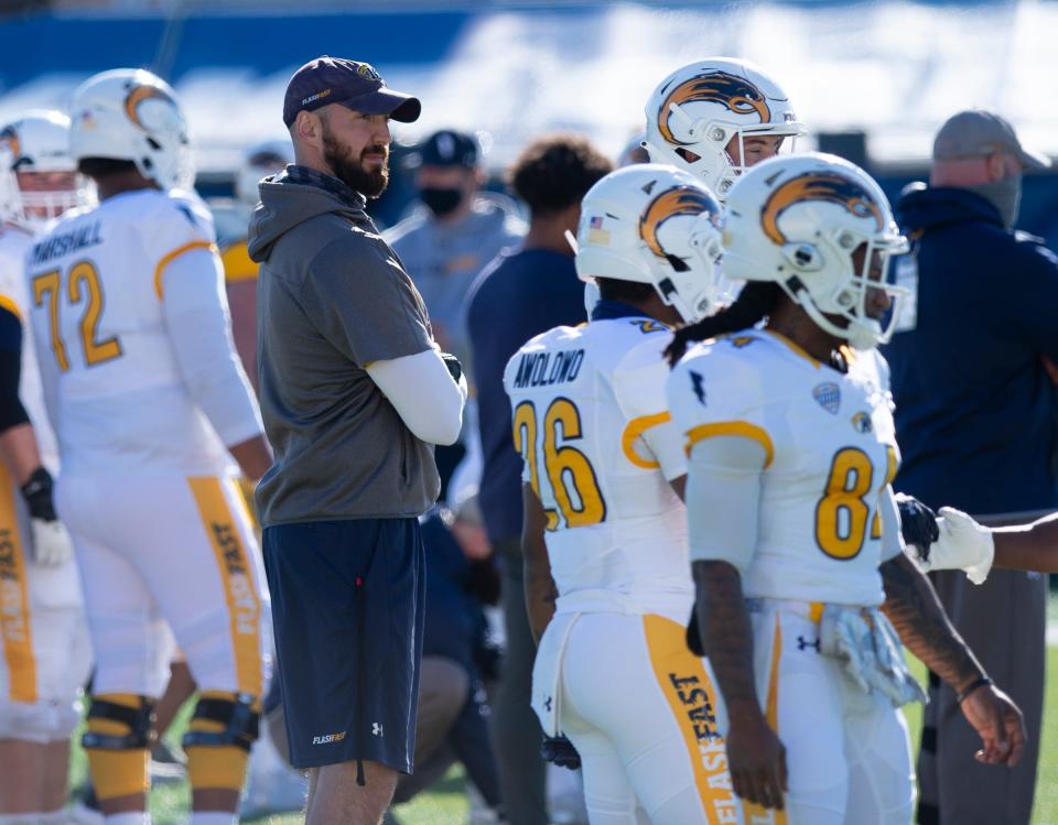 Head coach Sean Lewis is pictured with his players during the squad's annual Spring Game.