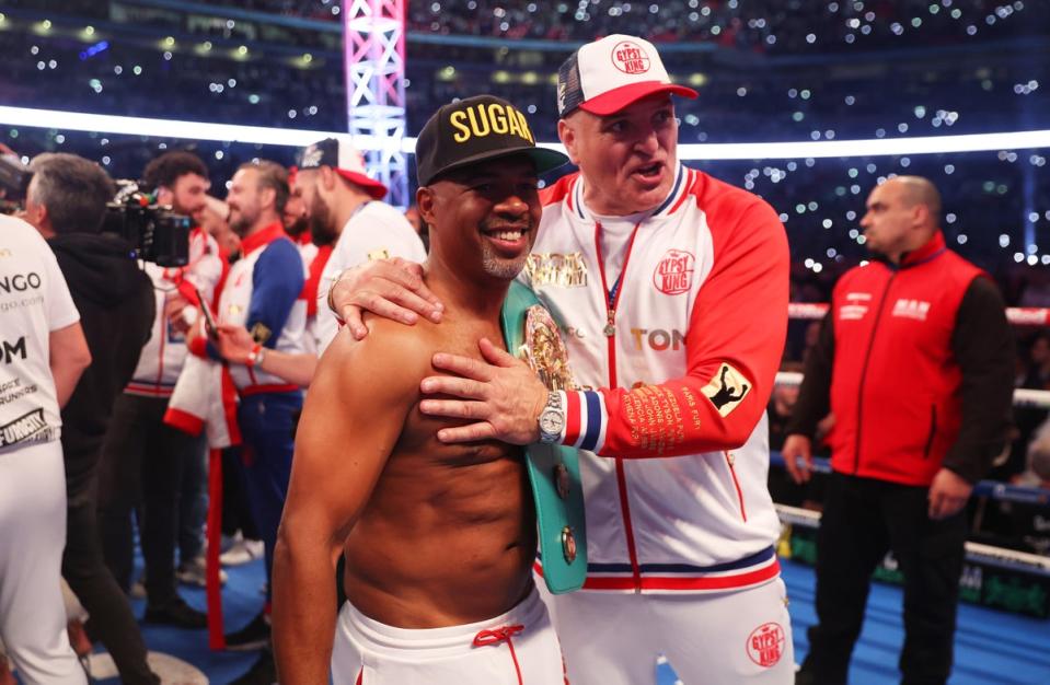 John Fury (centre-right) with his son’s coach Sugarhill Steward (Getty Images)