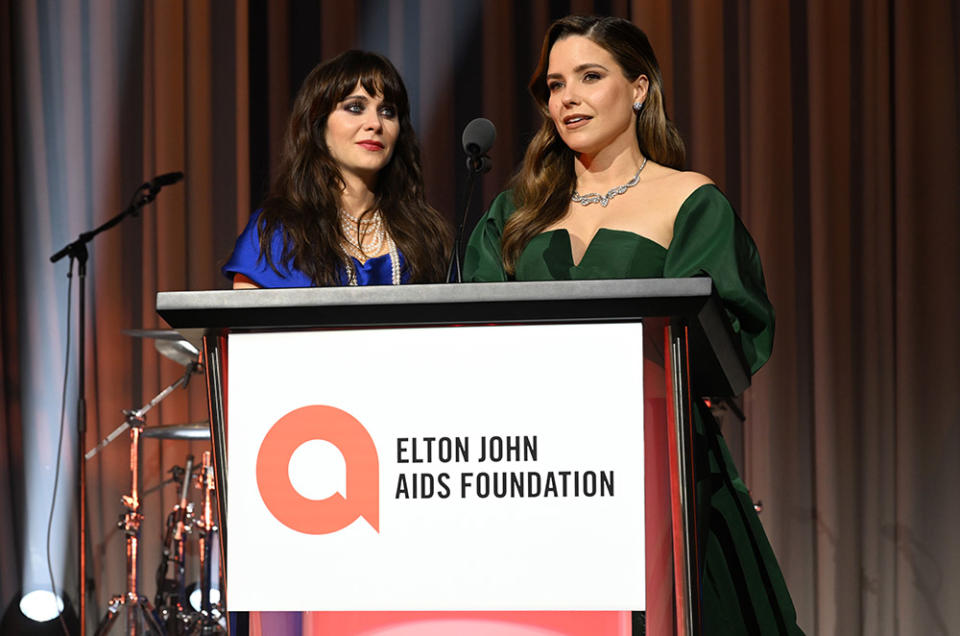 Zooey Deschanel and Sophia Bush speak onstage at the Elton John AIDS Foundation's 31st Annual Academy Awards Viewing Party on March 12, 2023 in West Hollywood, California.