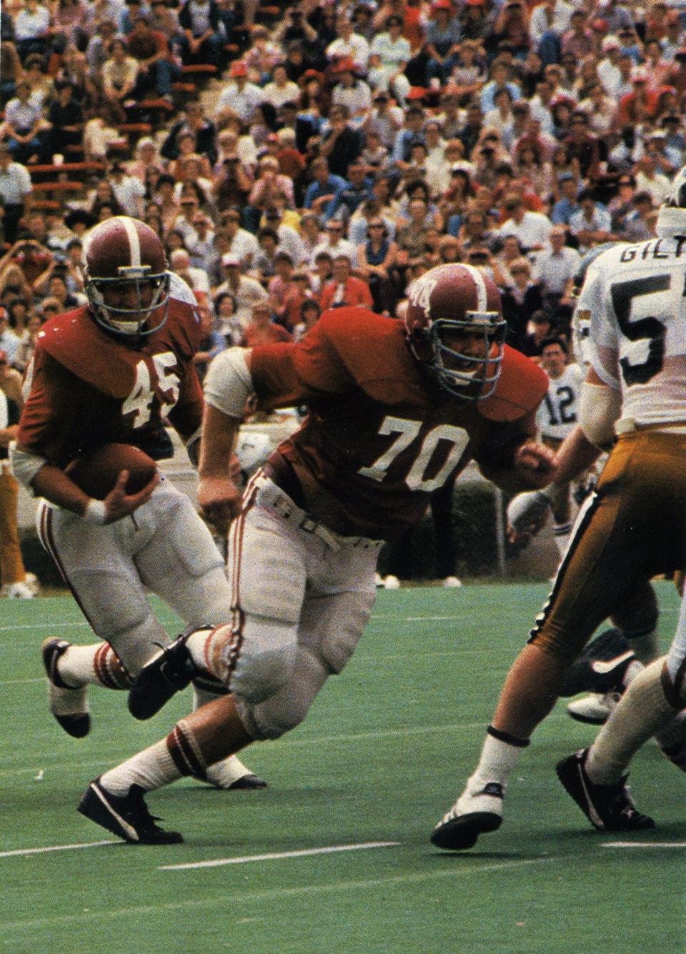 Mike Brock (70) blocks during an Alabama football game.