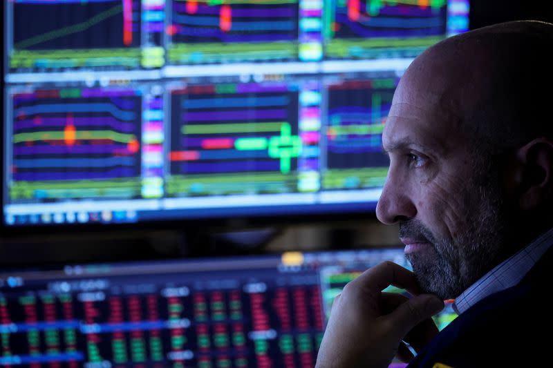 Traders work on the floor of the NYSE in New York City