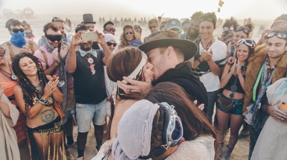 "This wedding was like a dream and definitely made me cry. Some of these people you see in these photos were their friends but many were random onlookers at Burning Man. The emotion and connection was unreal. Magical. You can feel the love in the photos." -- <i>Steph Grant</i>