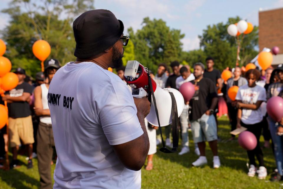 Brandon Allen, Khalil Amari Allen's father, speaks to community members during a vigil honoring his son in Southfield on Friday, July 14, 2023. Allen wore a shirt that reads, 'Sonny Boy,' which was his nickname for Khalil. "That's my son, that's my sonny, that's my sonny boy," he said. Allen was shot and killed while driving to get food the evening of July 11.