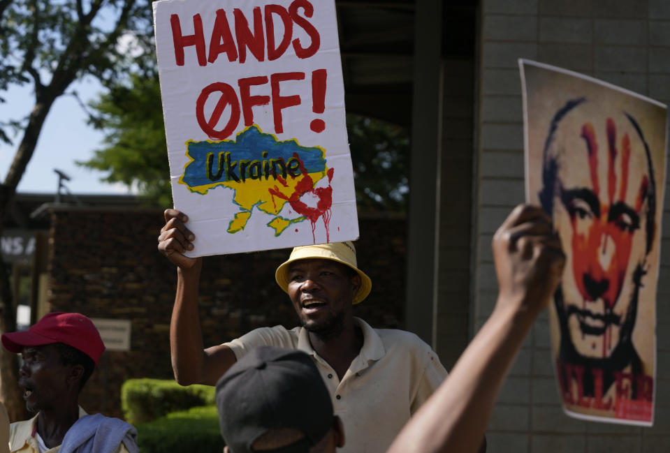 People supporting Ukraine picket against Russia's Foreign Minister Sergey Lavrov outside the Dirco (OR Tambo) Building in Pretoria, South Africa, Monday, Jan. 23, 2023. Lavrov arrived in South Africa for diplomatic talks with his counterpart amid heightened global tensions over the country's war with Ukraine. (AP Photo/Themba Hadebe)