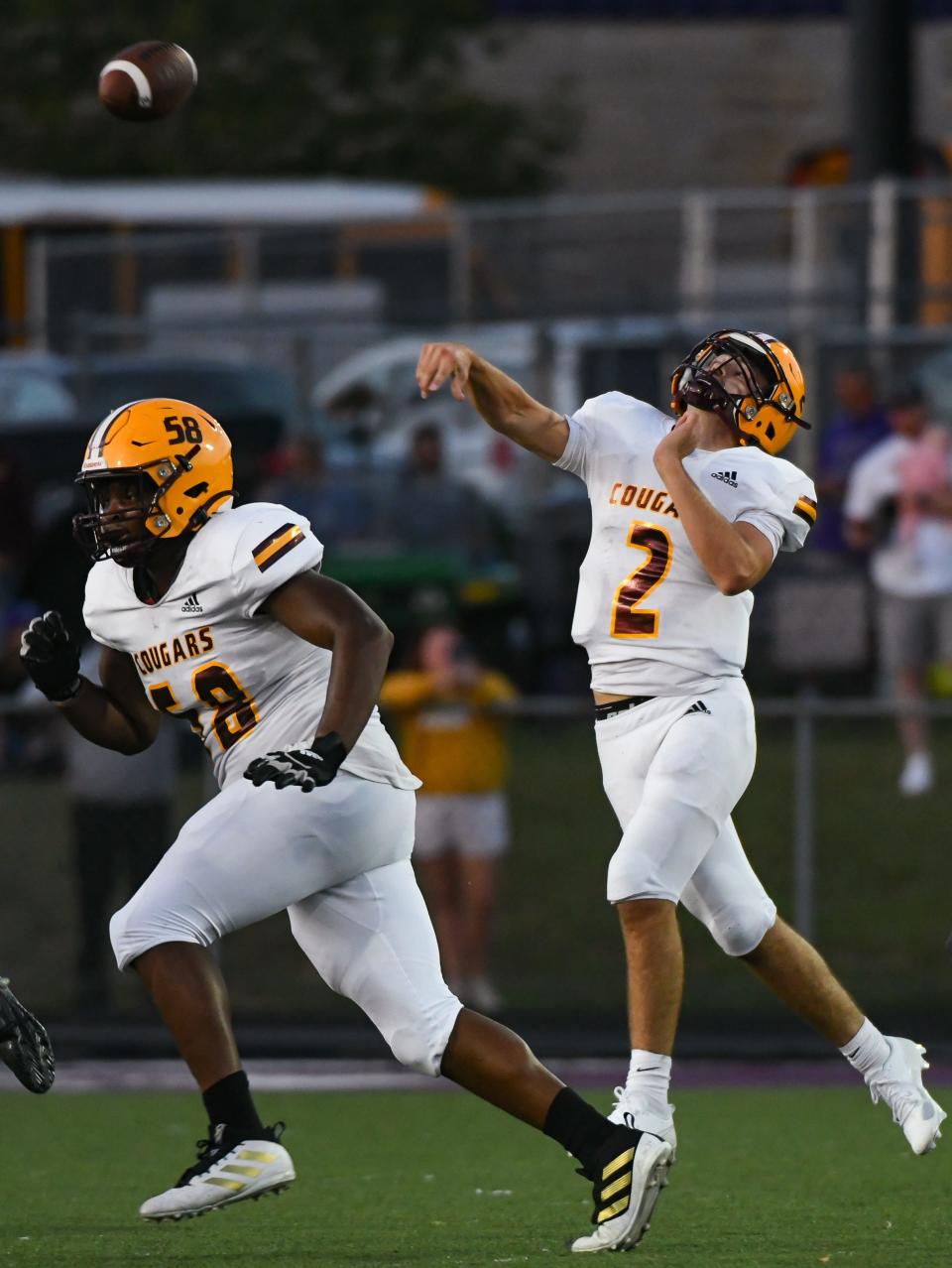 Bloomington North’s Dash King (2) throws a pass as Larry Staples (58) stays back for pass protection during the North-South football game at South on Friday, September 8, 2023.
