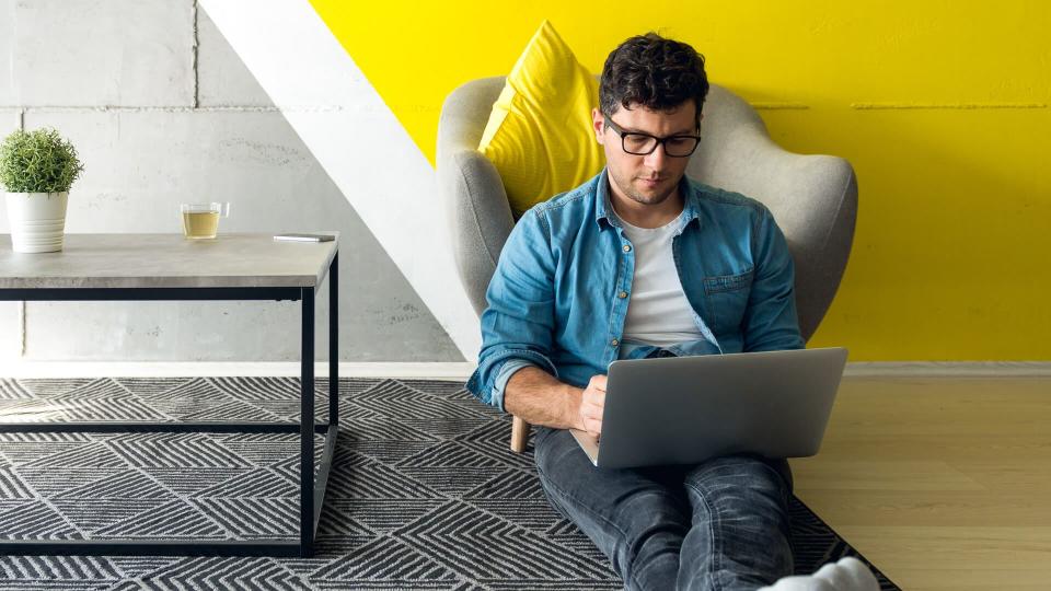 guy working from home for Amazon customer service in his living room