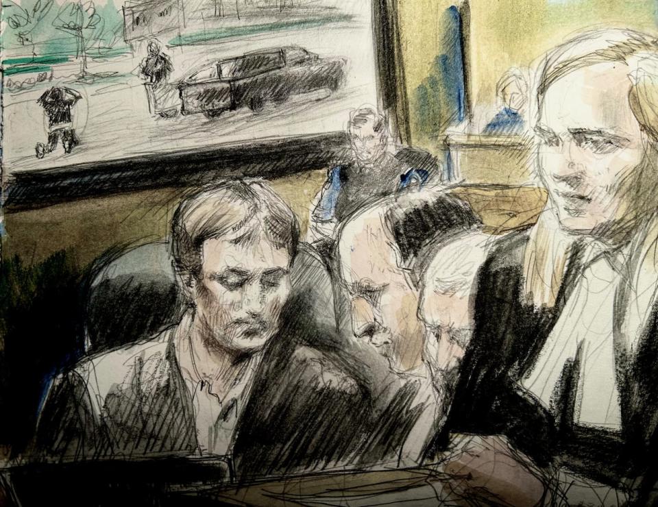 Court sketch shows Nathaniel Veltman, forefront left, in Ontario Superior Court in Windsor with lawyers, while the video behind them shows him surrendering to police minutes after the attack on the Afzaal family on June 6, 2021, in London. Proceedings in the 22-year-old's murder-terror trial began this week. (Pam Davies/CBC - image credit)