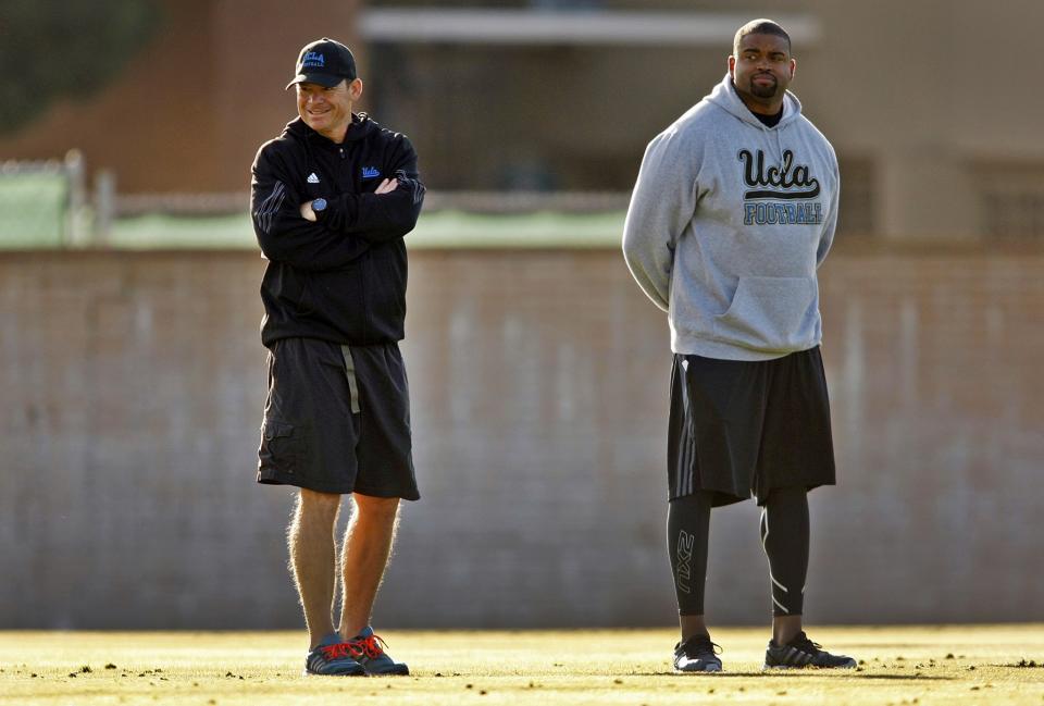 Adrian Klemm, right, spent the last five seasons as UCLA's offensive line coach. (Getty Images)